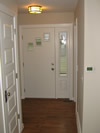 This entrance way receives a facelift with a new door and fresh paint.